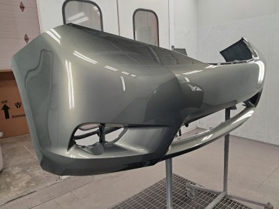 Newly repaired and painted front bumper of a vehicle