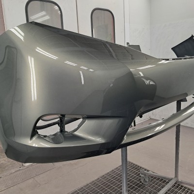 Newly repaired and painted front bumper of a vehicle